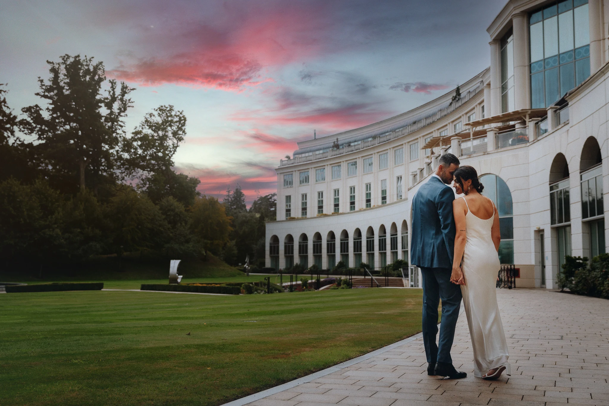 Bride and groom at sunset outside an elegant Irish wedding venue